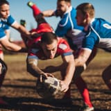 Rugby players in a rough tackle
